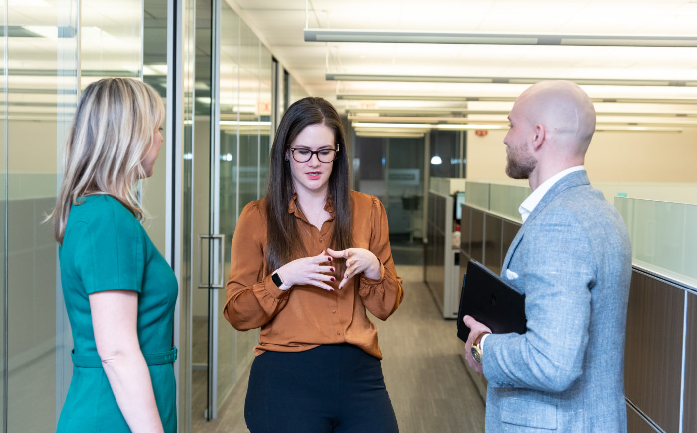 group of coworkers chatting in the office